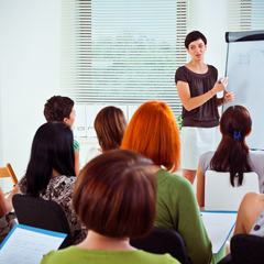 A person presenting to a group of people