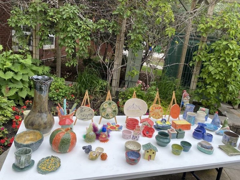 a collection of ceramic art showcased on a table