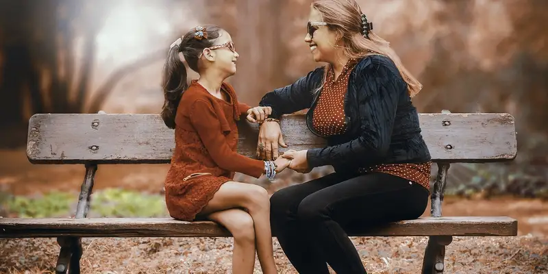 Woman with daughter_bench