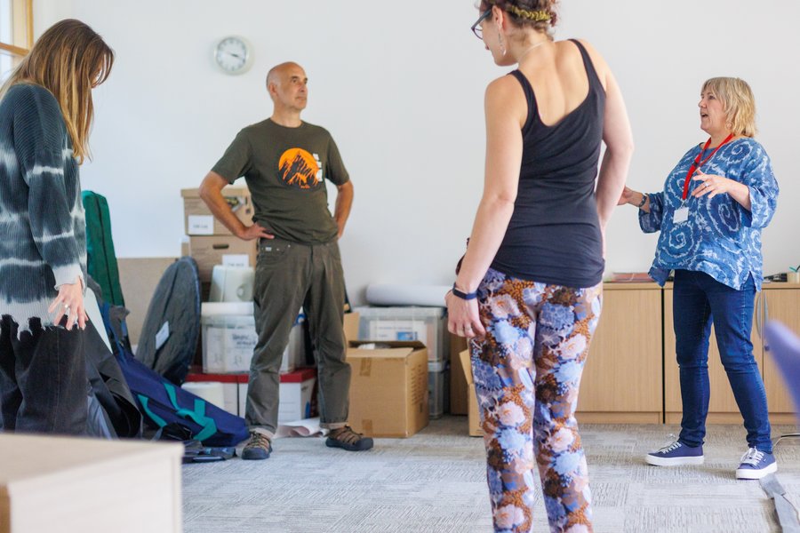 ground of people standing in a exercise class