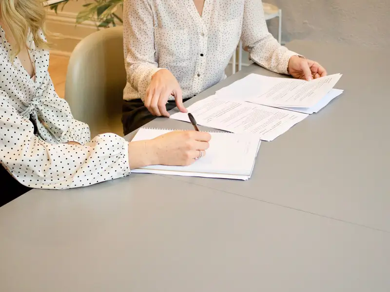 two people review paperwork
