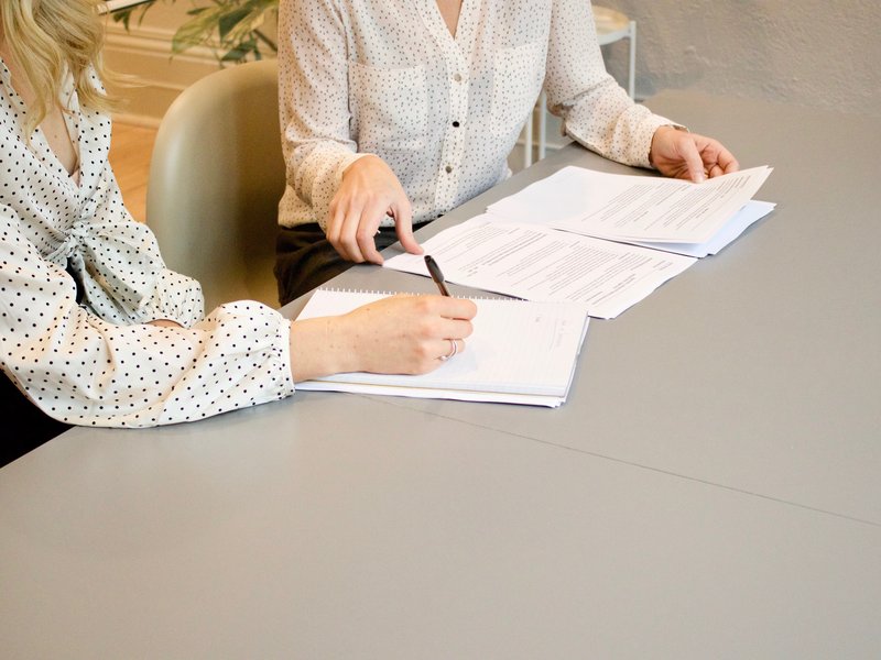 two people review paperwork