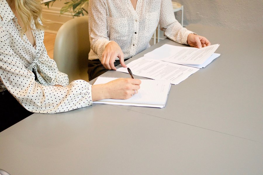 two people review paperwork