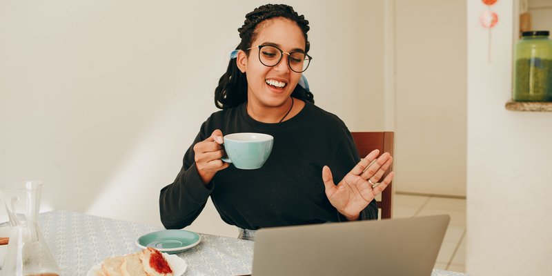 person waving on video chat