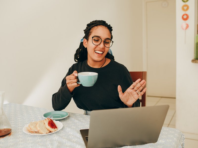 person waving on video chat