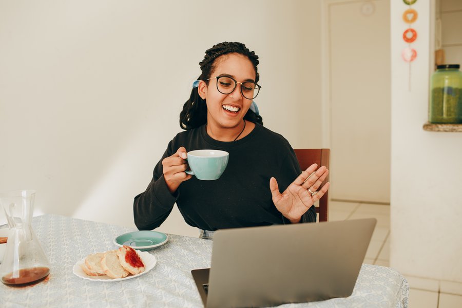 person waving on video chat