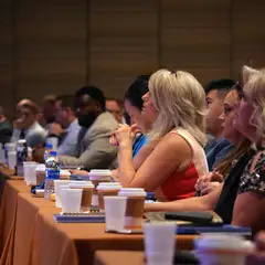 Audience of people at tables