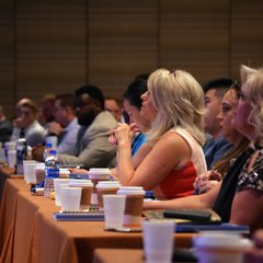 Audience of people at tables